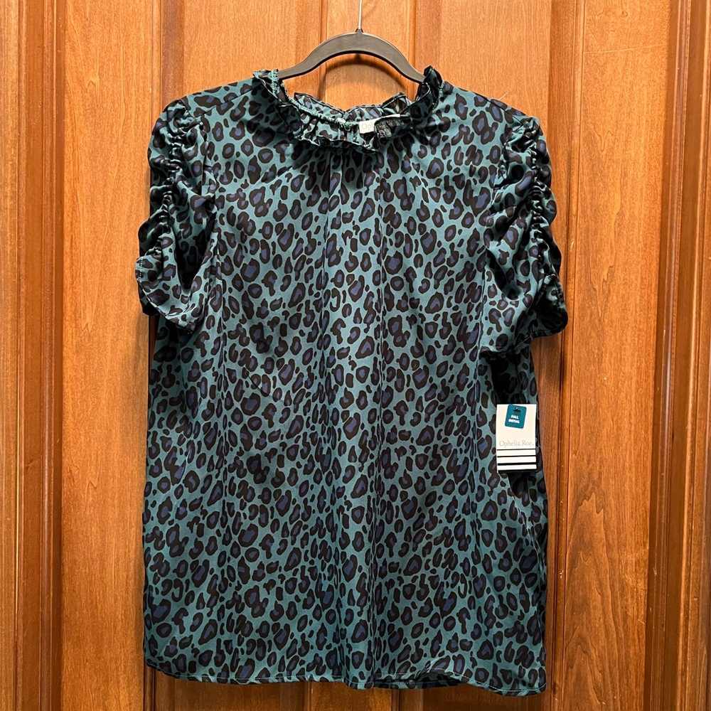 NEVER WORN. NWT. 
Blue/green/black leopard print. Rouched short sleeves.